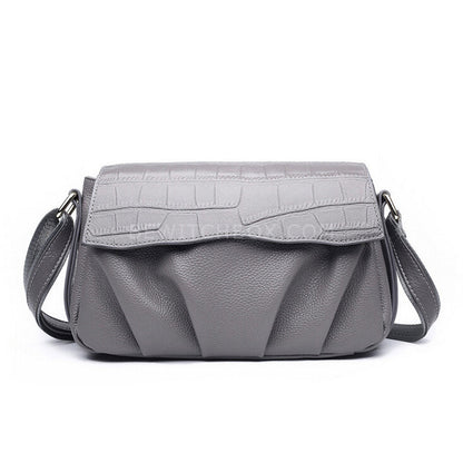 The crocodile lines inclined shoulder bag